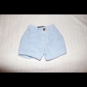 Baby boys blue and white striped shorts.